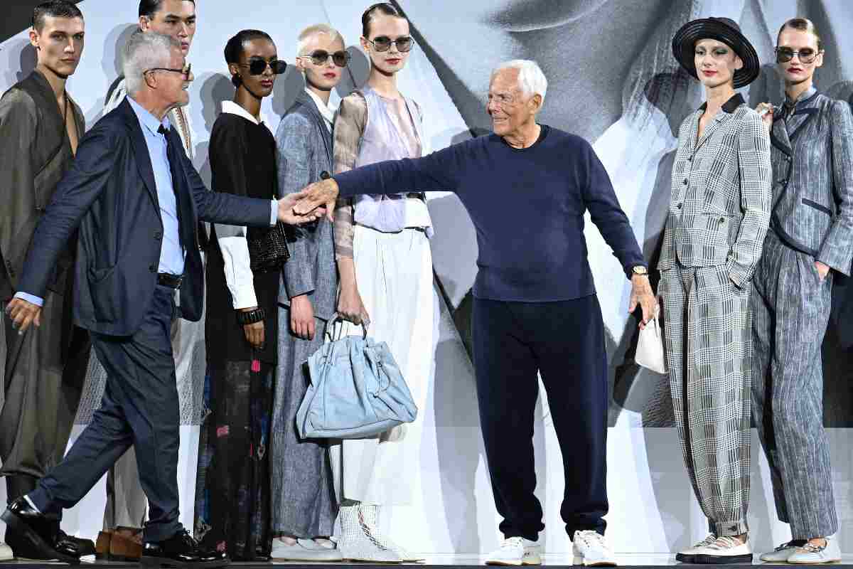 giorgio armani prende per mano leo dell'orco
